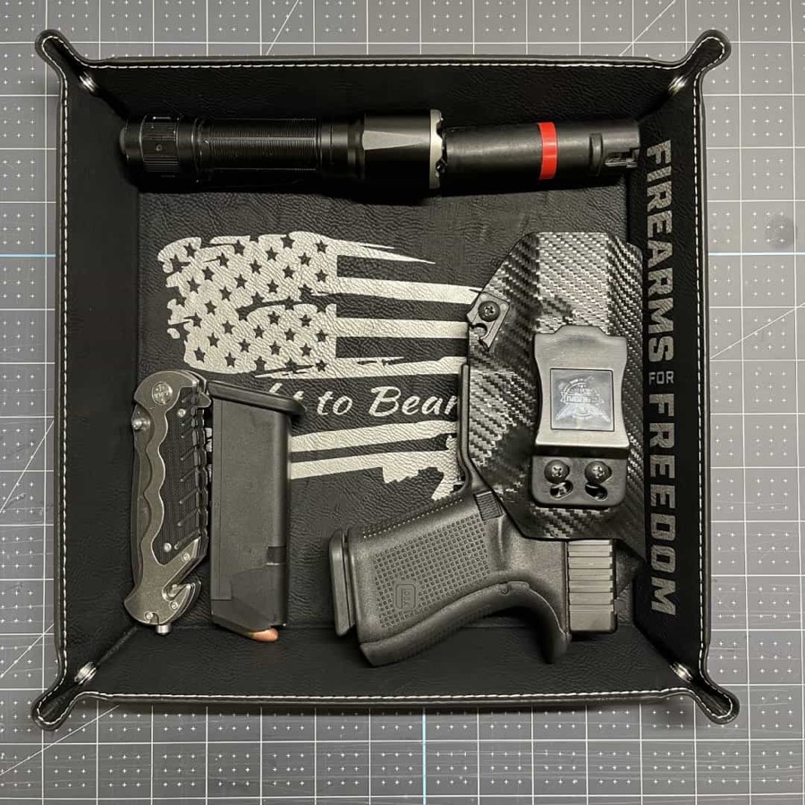 Engraved leather valet tray with a flag design