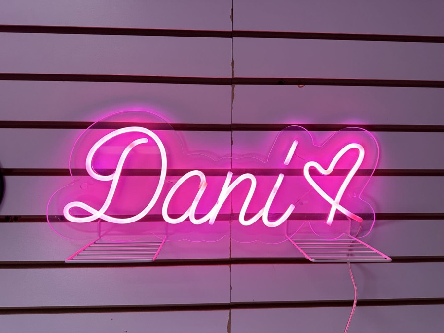 Pink custom neon sign reading Dani with a heart